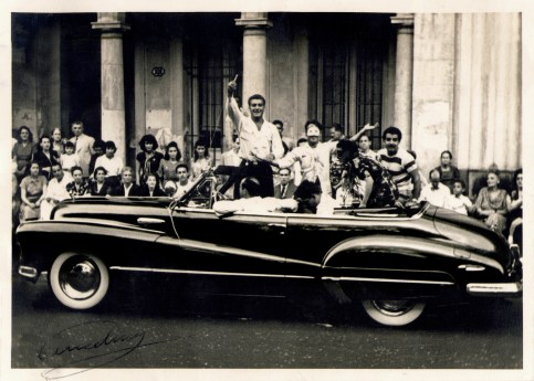 This 1947 photo was taken during Carnival festivities on Paseo del Prado in la Habana. The car is a Buick convertible owned by Grandpa's friend Armando. The man in the mask is another friend, Porfirio, and Tio Pepe is wearing the striped pullover.